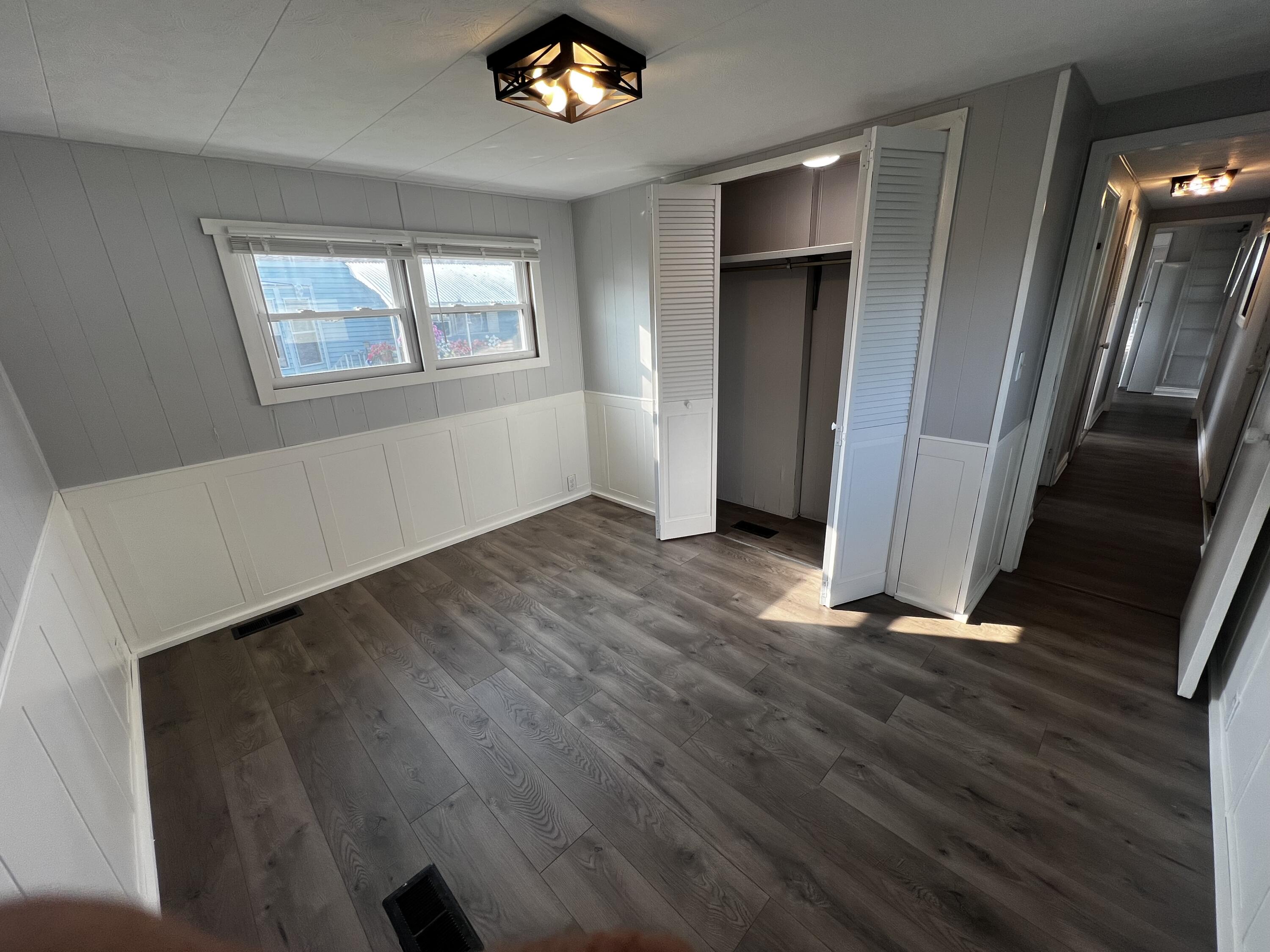 14 Joseph Street Wareham, MA 02538 - Photo 10 of 11 a view of an empty room with wooden floor and a window