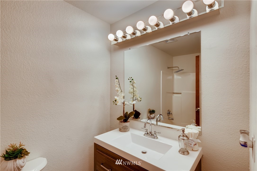 31404 3rd Place South Federal Way, WA 98003 - Photo 20 of 24 a bathroom with a sink mirror and vanity