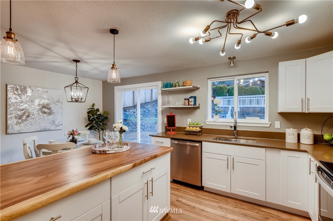 31404 3rd Place South Federal Way, WA 98003 - Photo 9 of 24 a kitchen with a sink and cabinets