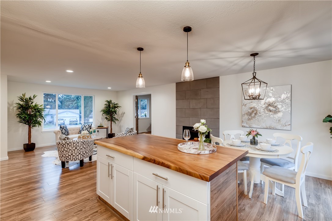 31404 3rd Place South Federal Way, WA 98003 - Photo 10 of 24 a view of a dining room and livingroom with furniture wooden floor a chandelier