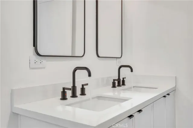 a bathroom with a sink and mirror