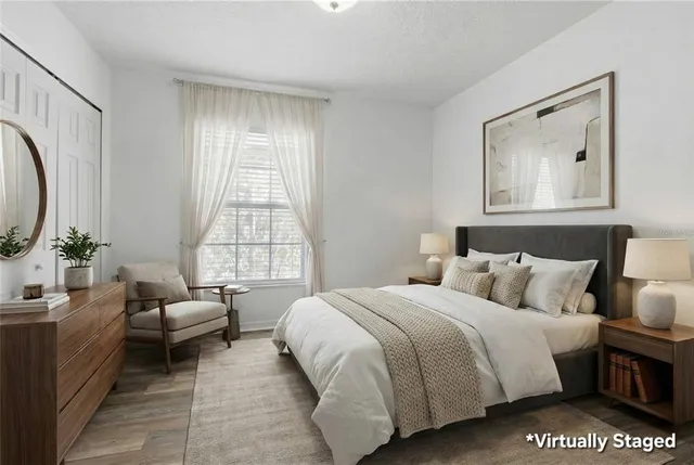 a view of a patio with couches table and chairs and potted plants