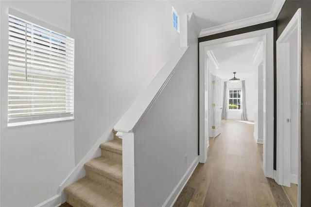 a large kitchen with stainless steel appliances granite countertop a stove a sink and a refrigerator