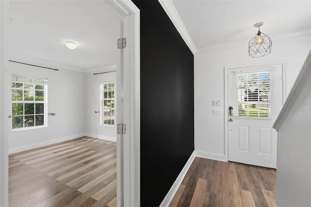 a kitchen with granite countertop stainless steel appliances a stove sink and microwave