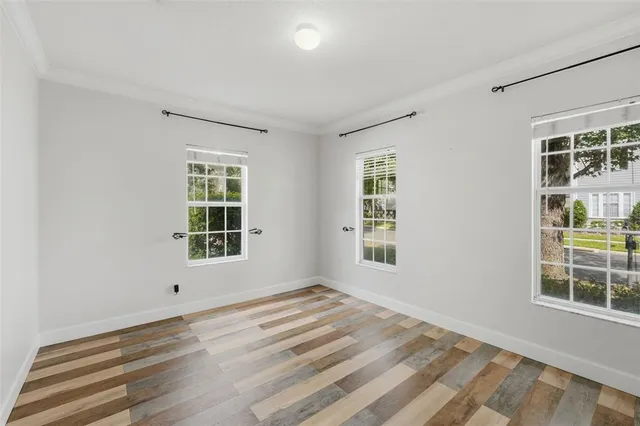 a kitchen with granite countertop white cabinets and a stove
