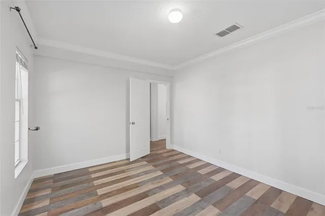 a view of a livingroom with furniture and wooden floor