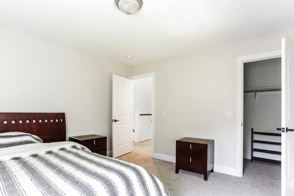 7 Station Street Kingston, MA 02364 - Photo 13 of 20 a bedroom with a bed and a dresser