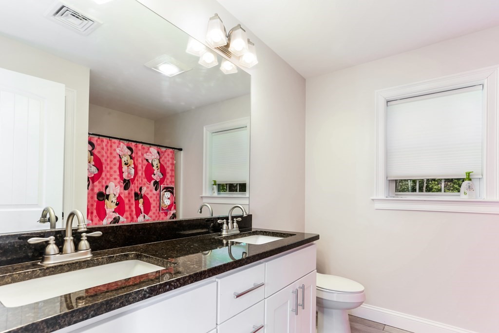 7 Station Street Kingston, MA 02364 - Photo 16 of 20 a bathroom with a granite countertop sink a toilet and a mirror