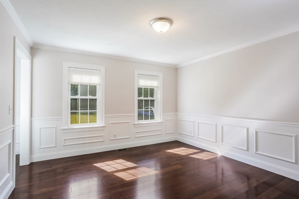 7 Station Street Kingston, MA 02364 - Photo 6 of 20 an empty room with wooden floor and windows