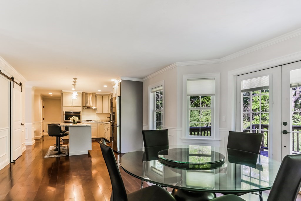7 Station Street Kingston, MA 02364 - Photo 7 of 20 a view of a dining room with furniture a chandelier and wooden floor