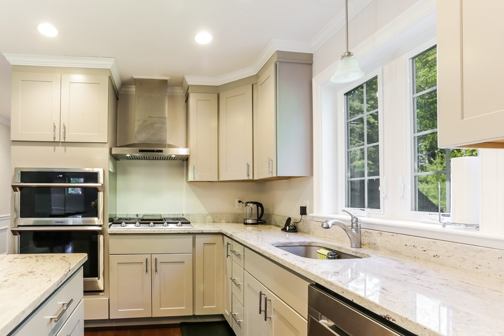 7 Station Street Kingston, MA 02364 - Photo 9 of 20 a kitchen with a sink stove and microwave