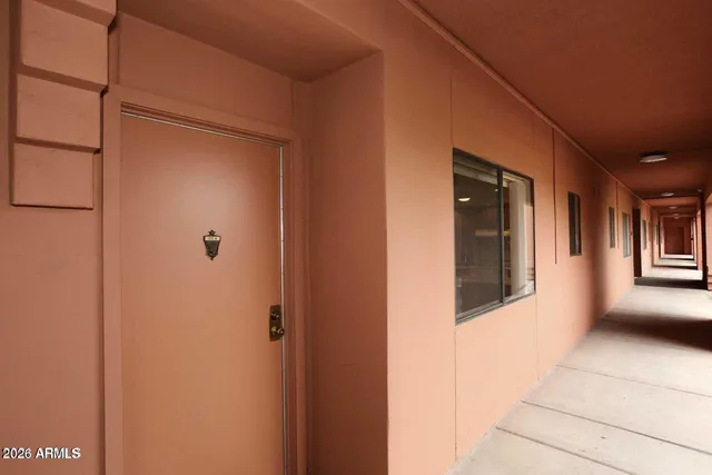 a bathroom with a bath tub with a shower