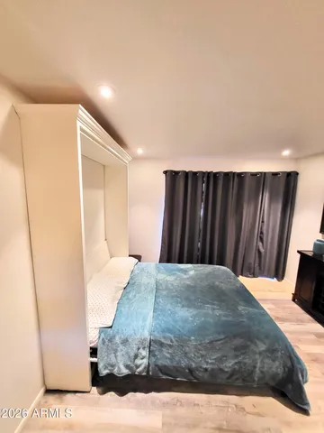 a room with a furniture and a window