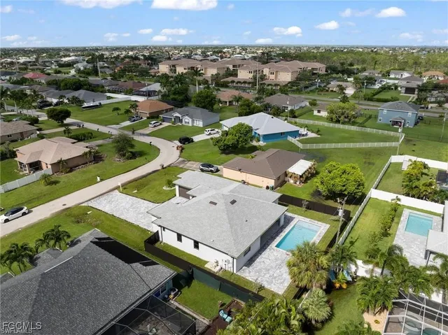 an aerial view of a house with a garden