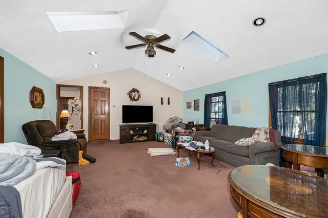 a living room with furniture workspace and a window