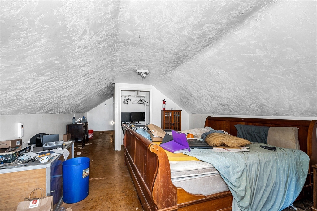 445 East Foster Street Melrose, MA 02176 - Photo 19 of 40 a bedroom with a bed and a tv