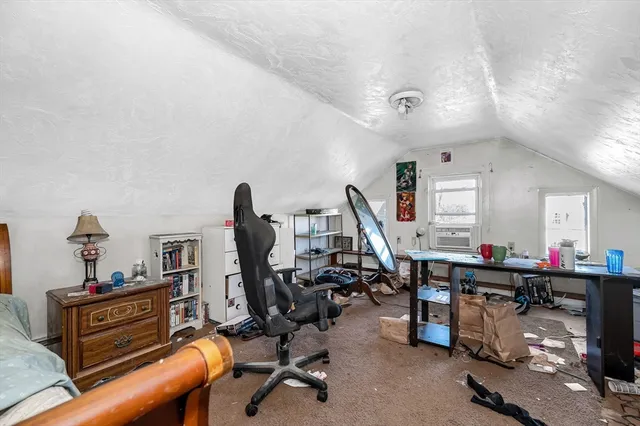 a bed room with a bed and a desk