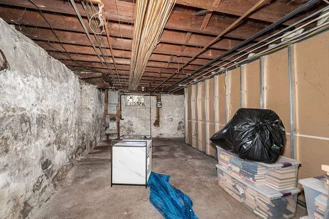 a bedroom with bed and a mirror