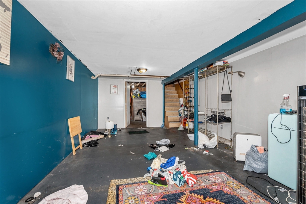 445 East Foster Street Melrose, MA 02176 - Photo 25 of 40 a living room with furniture a rug and white walls