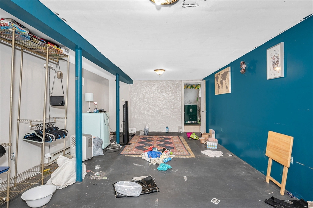 445 East Foster Street Melrose, MA 02176 - Photo 26 of 40 a bedroom with bed and a mirror