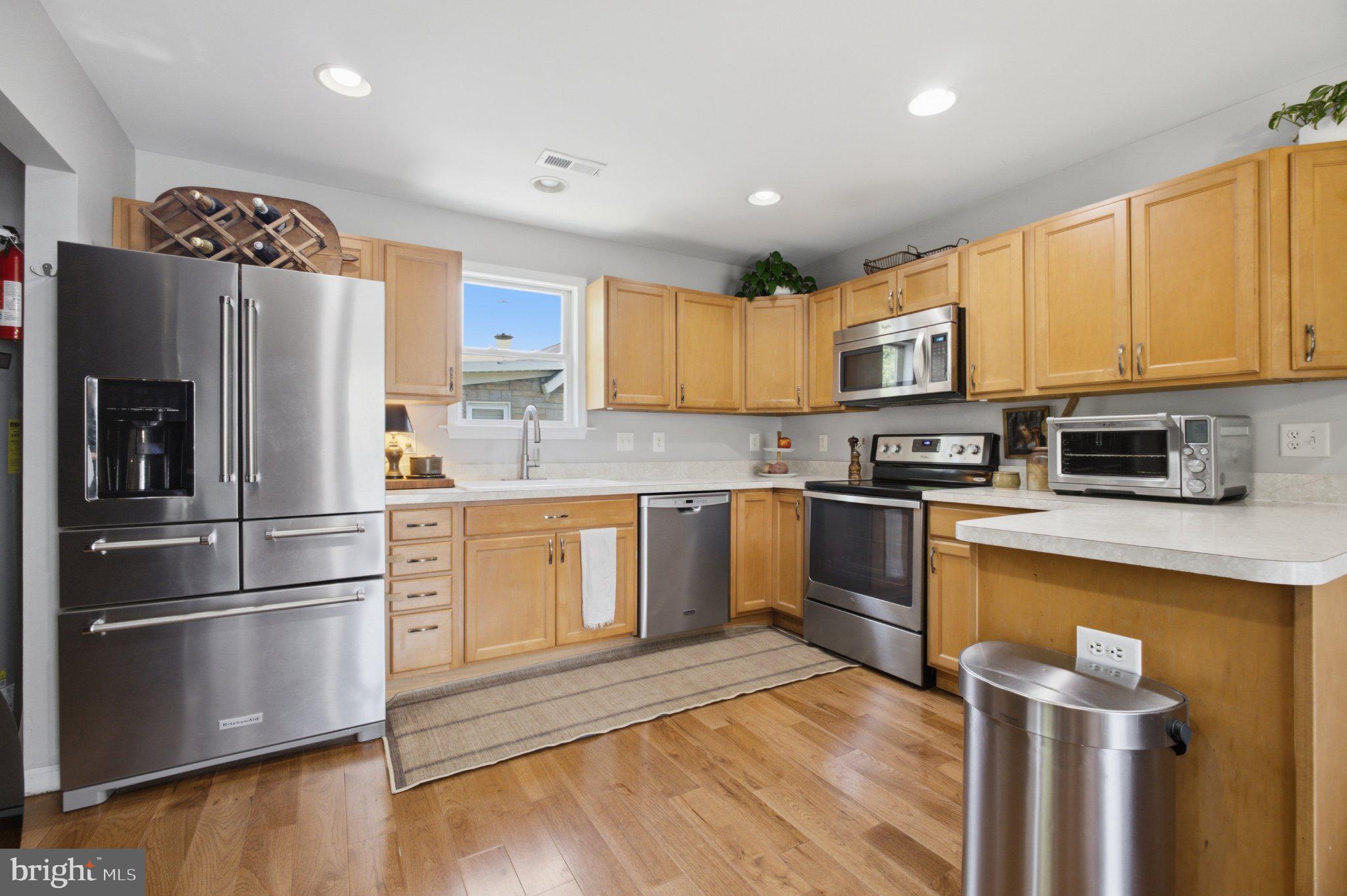 5650 Deale Churchton Road Churchton, MD 20733 - Photo 14 of 31 Modern kitchen with warm wood tones.