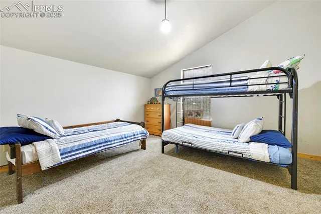 a bedroom with bed and window