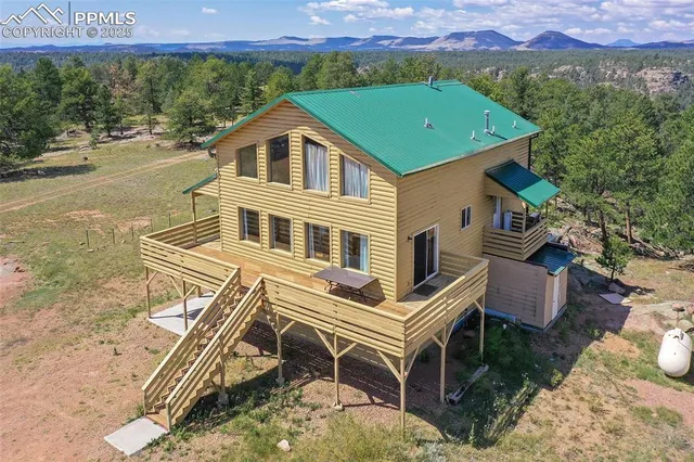 a aerial view of a house with a yard