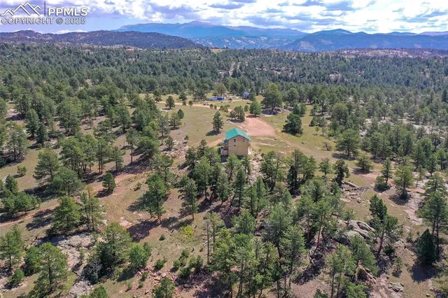 a view of a town with mountains in the background