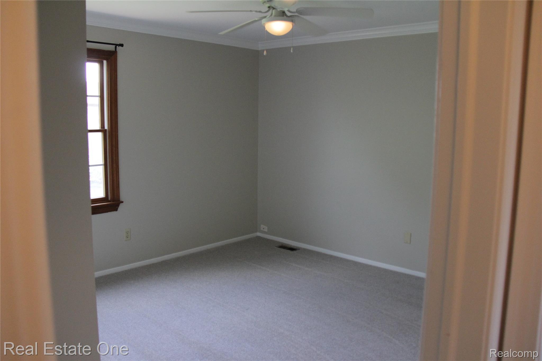44777 Saltz Road Canton, MI 48187 - Photo 47 of 65 Bedroom with a ceiling fan, crown molding, and a window with wood trim