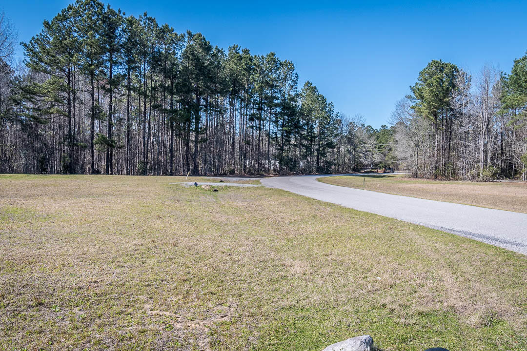144 Hidden Hills Road Cross, SC 29436 - Photo 2 of 18 06-Hidden Hills Rd toward the gate-HR