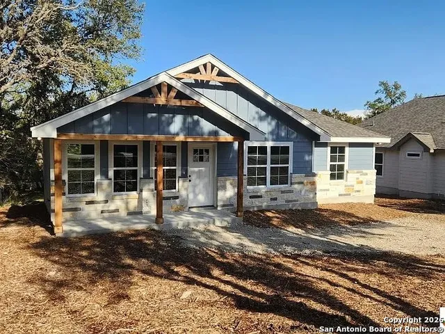 a front view of a house with yard outdoor seating and barbeque oven