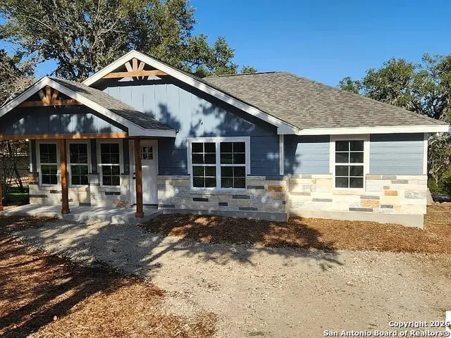 a front view of a house with a yard outdoor seating and yard