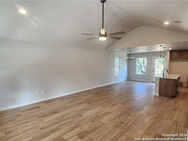 a view of livingroom with hardwood floor and ceiling fan