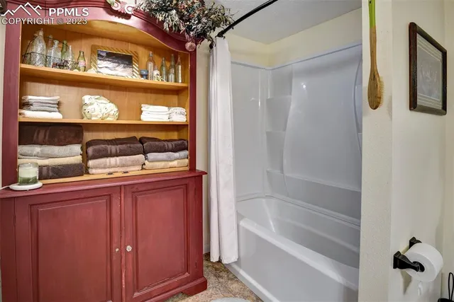 a bath room with a sink and a mirror