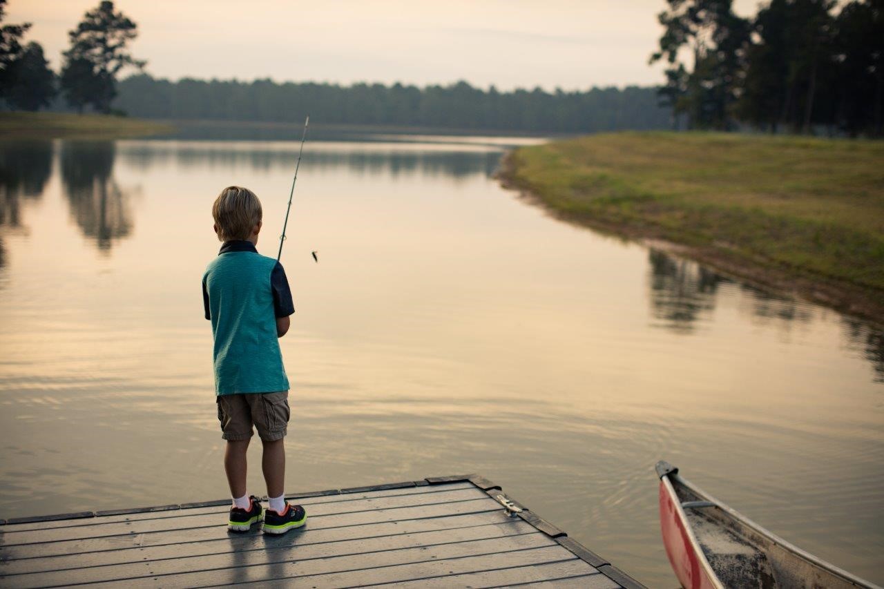 4 Poco Pine Court Tomball, TX 77377 - Photo 4 of 5 a view of a lake with a mountain in the background