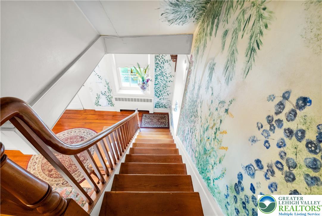 1742 Butztown Road Bethlehem, PA 18017 - Photo 37 of 56 A grand staircase to the second floor is graced with a hand-painted mural