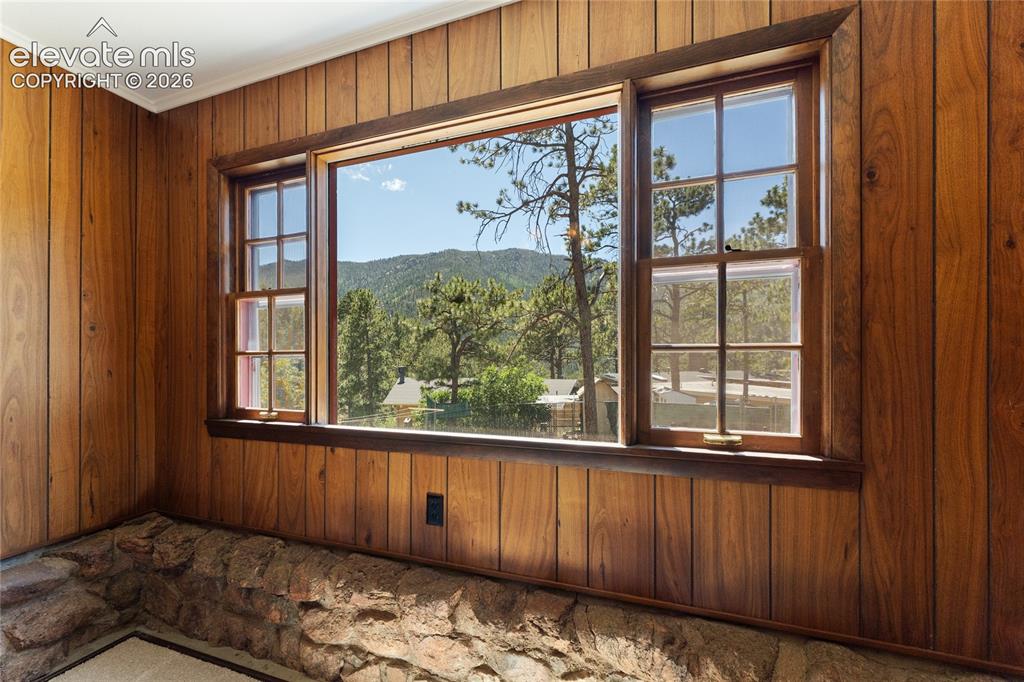 7755 Topeka Avenue Cascade, CO 80809 - Photo 14 of 38 Old stone foundation coming up around the dining window