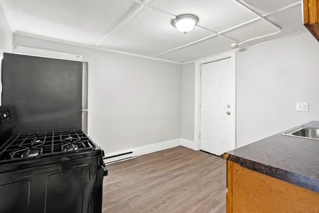 a kitchen with a stove and a refrigerator
