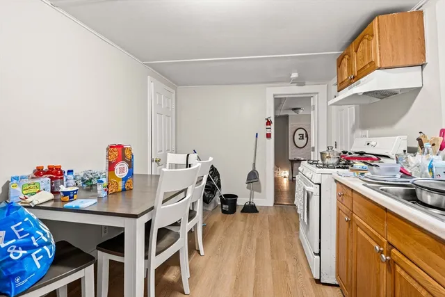 a view of a kitchen with baby and breakfast area
