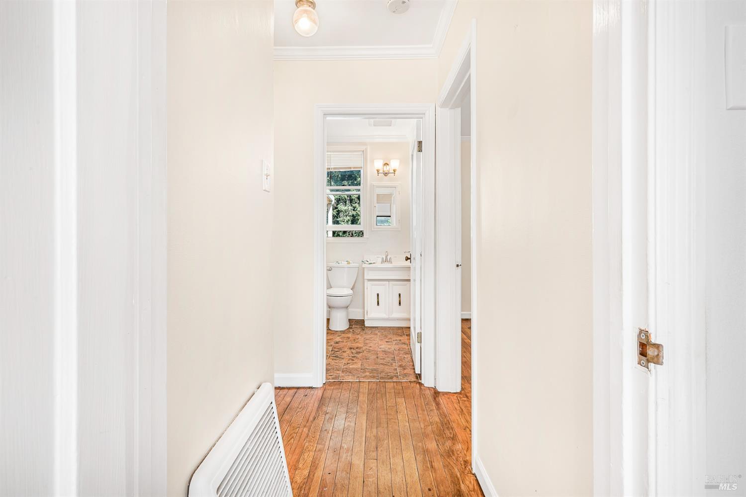 41 Meadow Avenue San Rafael, CA 94901 - Photo 19 of 55 Hallway at the entrance to the front bedroom. View to the bathroom. Floor heater is visible.