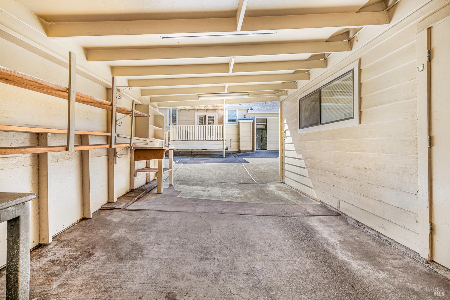41 Meadow Avenue San Rafael, CA 94901 - Photo 41 of 55 This is the "carport" area. There are overhead lights. View towards the back of the house.