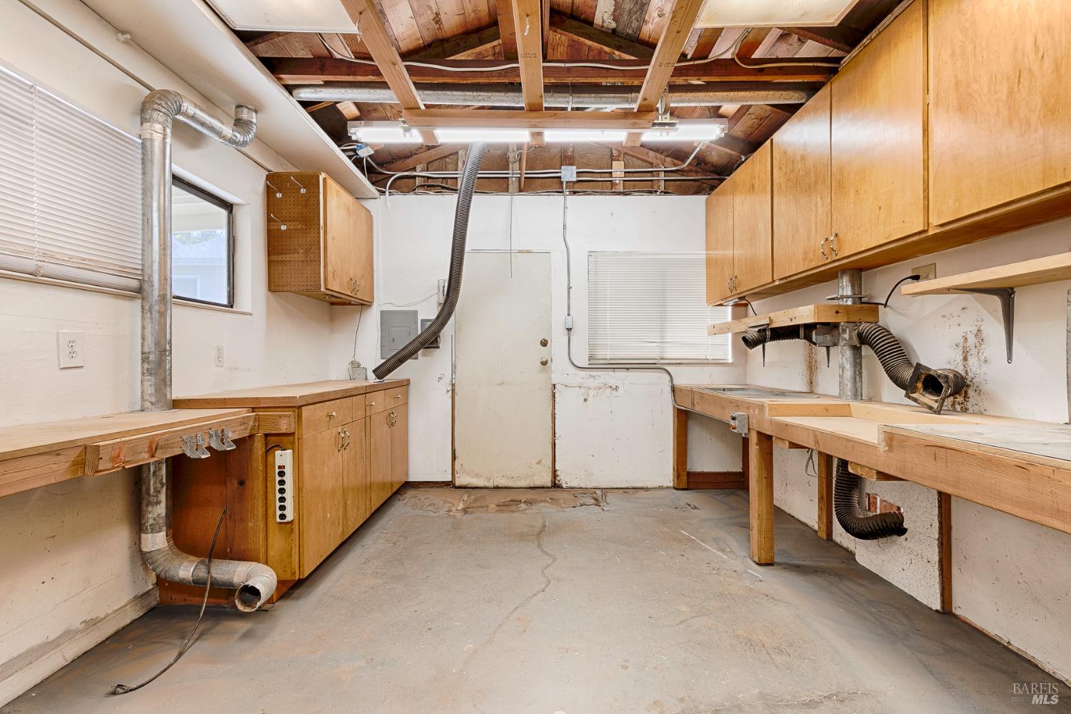 41 Meadow Avenue San Rafael, CA 94901 - Photo 43 of 55 This was a woodworking and hobby shop. There is overhead lighting and there are two doors. This view faces the back of the house. The other door is to the left, as is the carport.