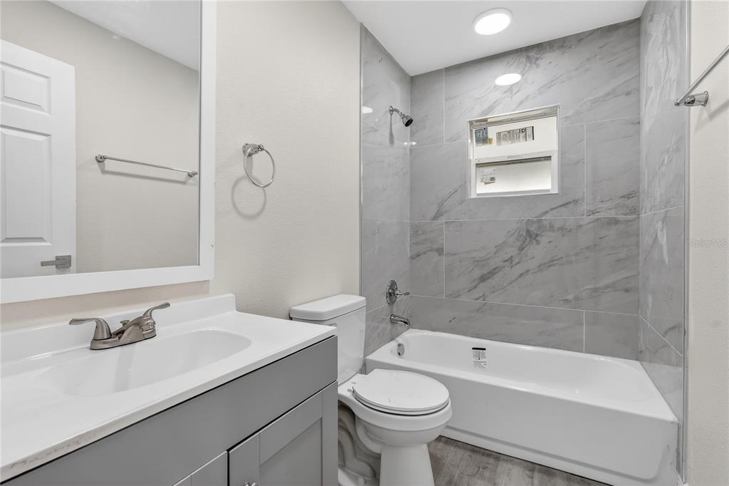 40415 Country Road Eustis, FL 32736 - Photo 11 of 39 a bathroom with a sink toilet and shower