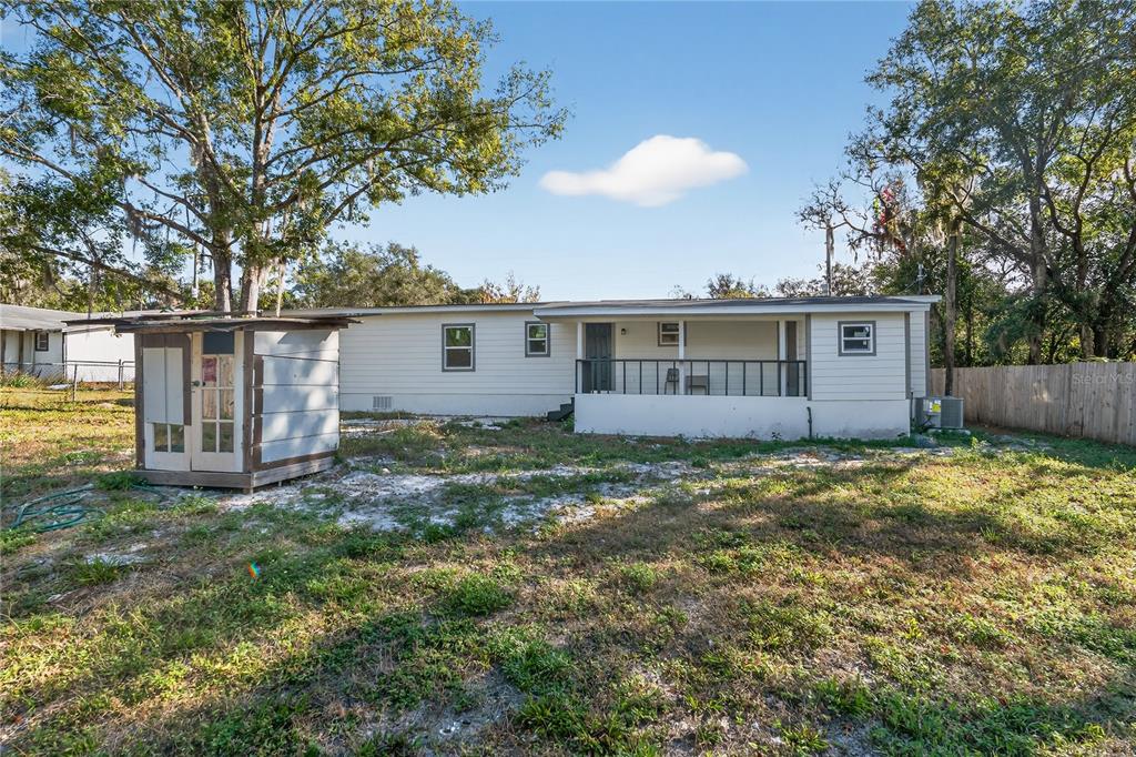 40415 Country Road Eustis, FL 32736 - Photo 3 of 39 a view of a house with a backyard