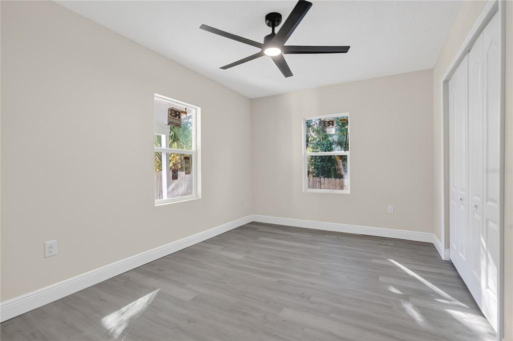 40415 Country Road Eustis, FL 32736 - Photo 34 of 39 wooden floor in an empty room with a window