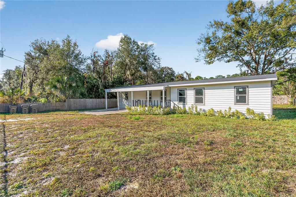 40415 Country Road Eustis, FL 32736 - Photo 5 of 39 front view of a house with a yard
