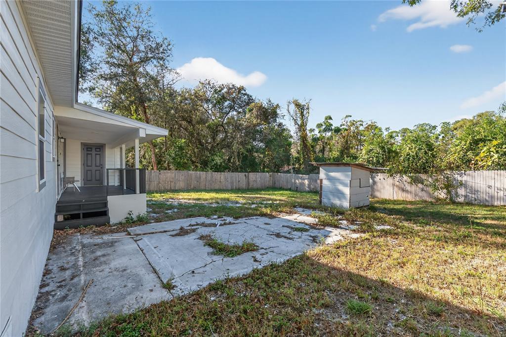 40415 Country Road Eustis, FL 32736 - Photo 7 of 39 a view of a yard with plants and a tree