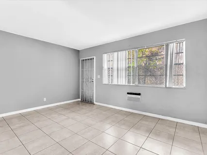 a view of an empty room with a window