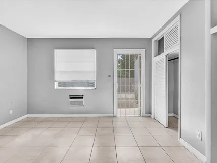 a view of an empty room with a window