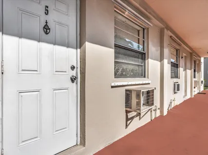 a view of a hallway with windows